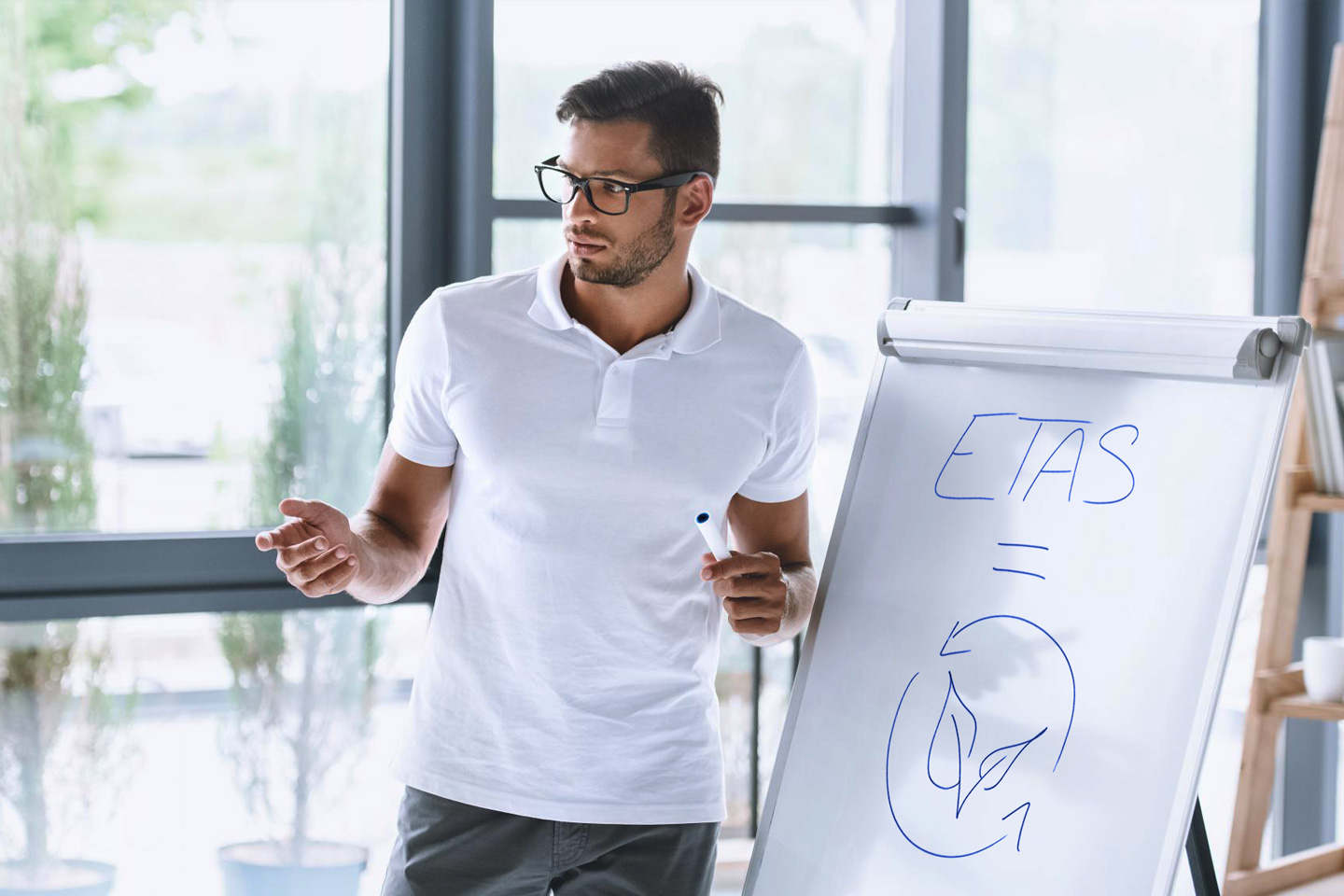 Man drawing on a white paper 